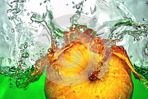 Yellow apple moving green water splash and drops