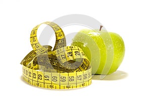 Yellow apple and tape measure