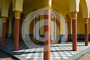 Yellow arcades and terracotta columns