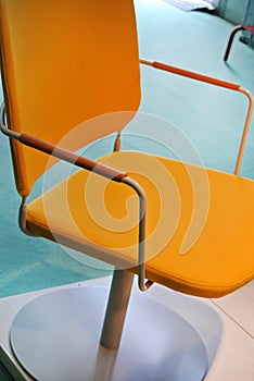 Yellow armchair in fabric and metal
