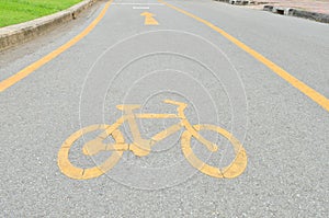 Yellow arrows and bicycle sign path
