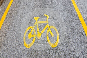 Yellow arrows and bicycle sign path