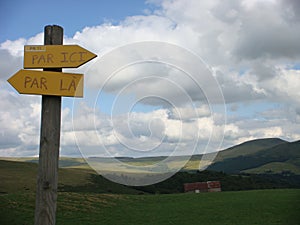 Yellow arrows paths mountain indications in the Auvergne Vulcanos in France. 