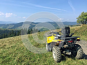 Yellow ATV in the mountains