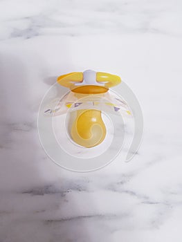 Yellow baby pacifier