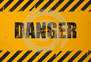Yellow background with black grunge danger sign
