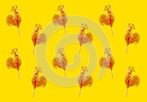 Yellow background: caramel cockerels lollipops