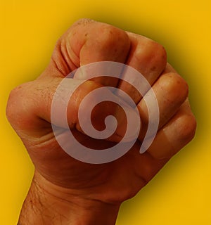 Yellow background fist punch