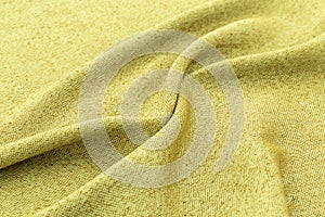 Yellow background luxury cloth or wavy folds of grunge silk texture satin velvet