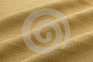 Yellow background luxury cloth or wavy folds of grunge silk texture satin velvet