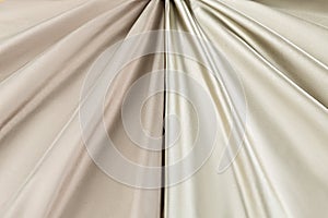 Yellow background luxury cloth or wavy folds of grunge silk texture satin velvet