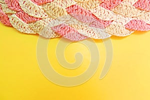 yellow background with space for text and textured surface with interweaving of straws