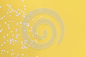 Yellow background with stars, glitter spangles.