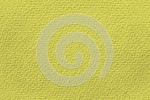 Yellow background with structure texture of rough canvas burlap fabric close-up