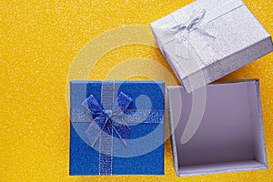 Yellow background with two glitter gift box with copy space