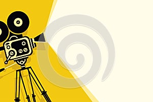 Yellow background with vintage movie camera