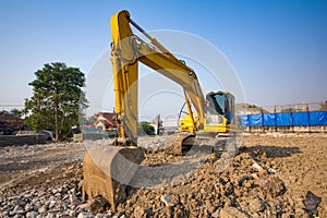 yellow backhoe loader on construction site and work