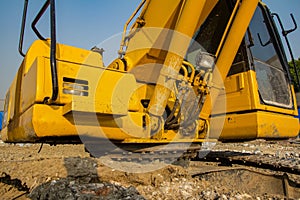 yellow backhoe loader on construction site and work