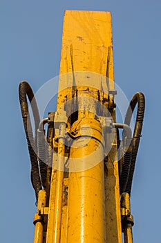 yellow backhoe loader on construction site and work