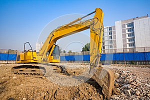 yellow backhoe loader on construction site and work