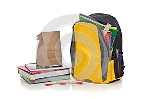 Yellow backpack with school supplies