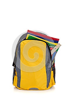 Yellow backpack with school supplies