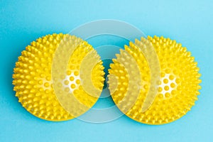 yellow balancers on a light blue background, treatment and prevention of flat feet, hallux valgus