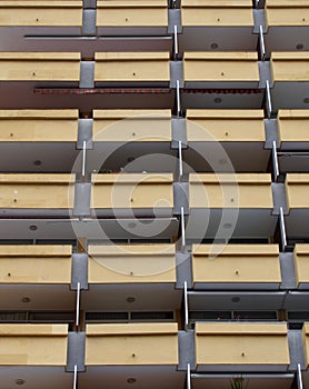 Yellow balconies in a modern highrise apartment block or holiday