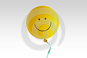 Yellow balloon with smile on white background - Concept of optimism and positive thinking