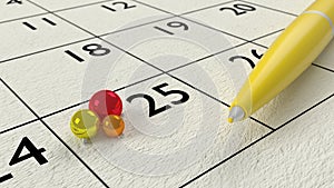 Yellow ballpen on a paper calendar closeup