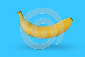 Yellow banana isolated on blue background with a shadow