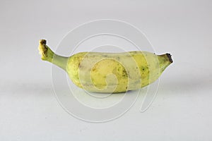 Yellow banana near ripening on a white background.