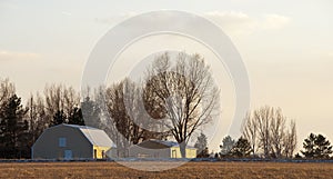 Yellow Barns in Golden Light of Sunset