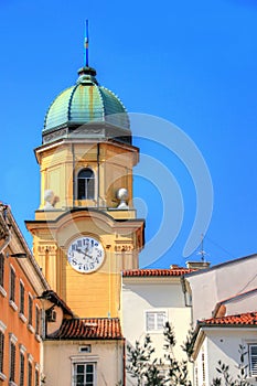 Yellow Baroque clock tower landmark building of Rijeka Croatia