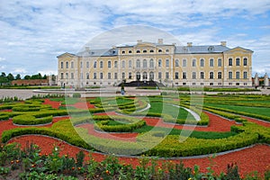 Yellow baroque Rundale palace with garden in foreground, Latvia