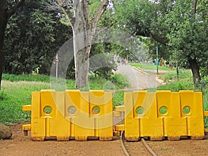 YELLOW BARRICADES IN PARK