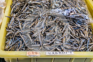 Yellow basin filled with dried ansjovis in Tai O, Hong Kong China