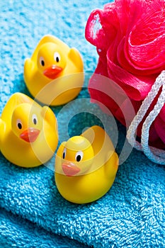 Yellow bath ducks and bath puff