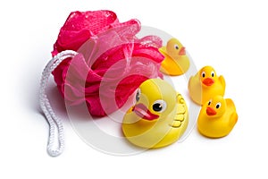 Yellow bath ducks and bath puff