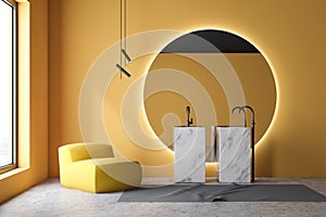 Yellow bathroom interior, marble sink and armchair