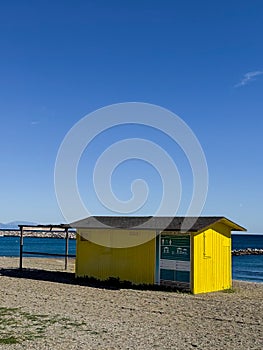 Yellow beach hut on deserted beach