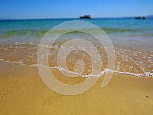 Yellow beach sand and beautiful blue sea. Natural living. Pelion peninsula. Pagasetic gulf. Platanias village. Greece.