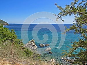 Yellow beach sand and beautiful blue sea. Natural living. Pelion peninsula. Pagasetic gulf. Platanias village. Greece.