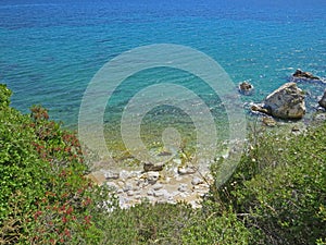 Yellow beach sand and beautiful blue sea. Natural living. Pelion peninsula. Pagasetic gulf. Platanias village. Greece.