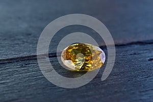 Yellow Is a beautiful red gemstone on a wooden floor