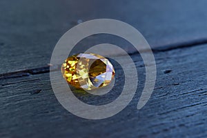 Yellow Is a beautiful red gemstone on a wooden floor