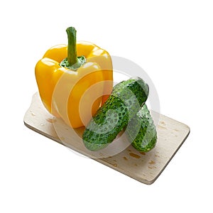 Yellow bell pepper and 2 cucumbers isolated on white background