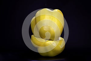 Yellow bellpepper or capsicum isolated on black background