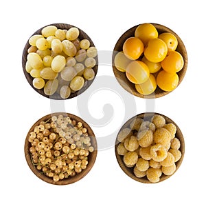 Yellow berries/fruits isolated on white background. Collage of different yellow berries. Yellow currants, yellow raspberries, grap