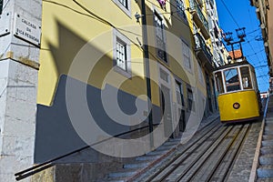 Yellow Bica Elevator Elevador da Bica in the historic neighborhood of Bica in Lisbon, Portugal photo